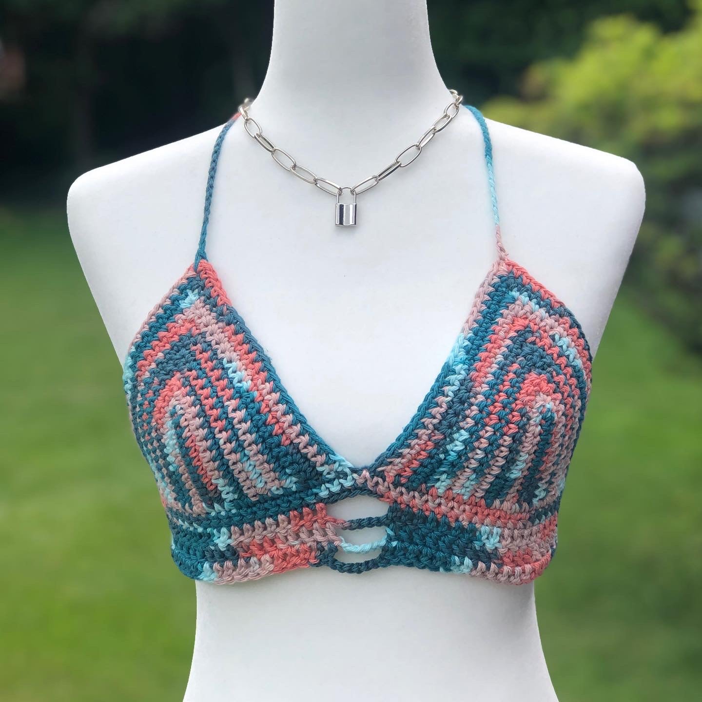 pink, dark blue, light blue, and coral colored crochet bikini style top with corset back 